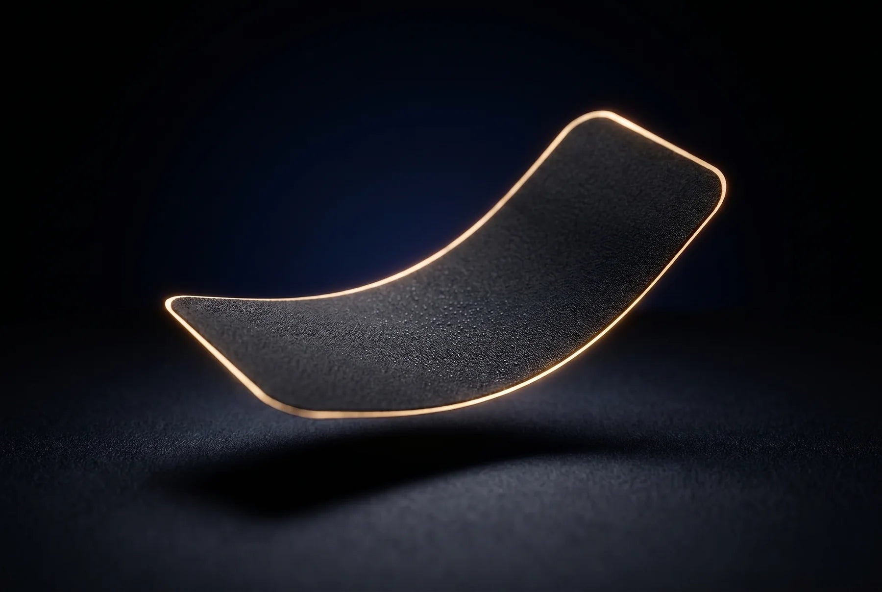 A single matte-black XIM strip with a glowing gold edge